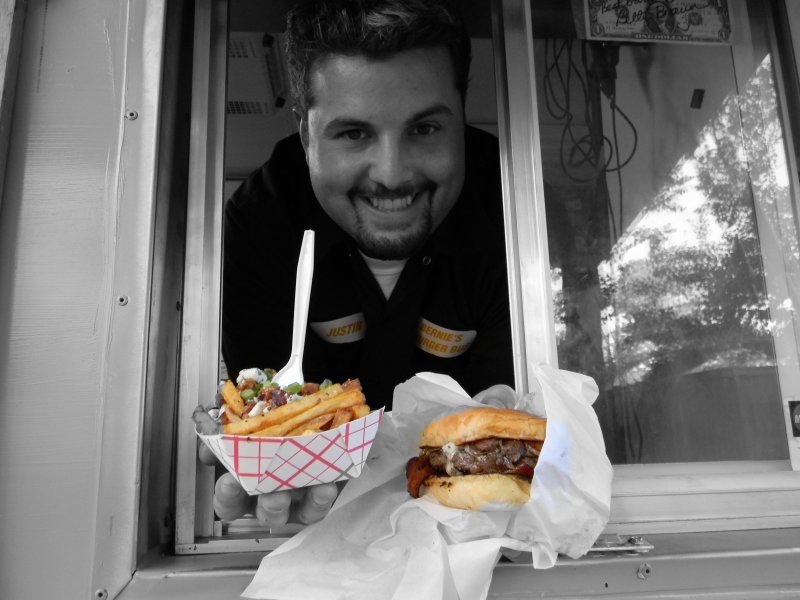 Justin Turner handing a burger and fries through the window